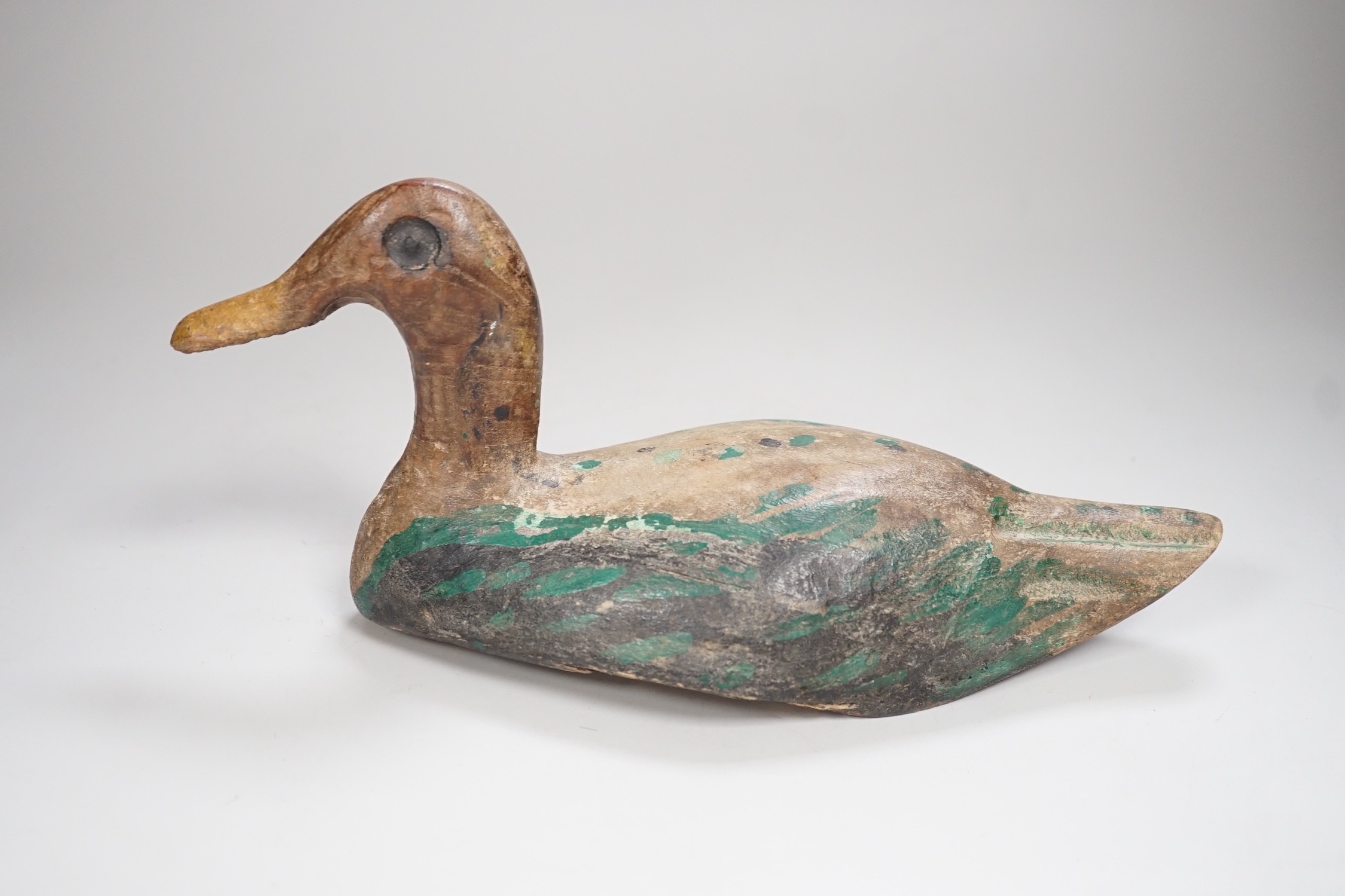 A 19th century painted decoy duck. 31cm long